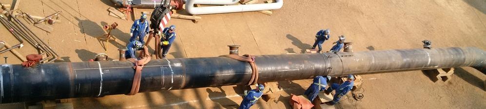 JLG Industries workers on a large pipeline